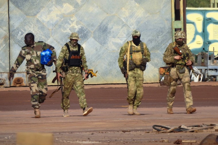 FILE - This undated photograph handed out by French military shows three Russian mercenaries, right, in northern Mali. Russia's Wagner Group, a private military company led by Yevgeny Prigozhin, a rogue millionaire with longtime links to Russia's President Vladimir Putin, has played a key role in the fighting in Ukraine and also deployed its personnel to Syria, Central African Republic, Libya and Mali. (French Army via AP, File)