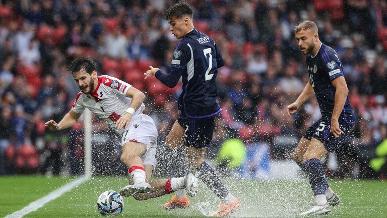 GLASGOW, SCOTLAND - JUNE 20: Scotand's Aaron Hickey and Georgia's Khvicha Kvaratskhelia during a UEFA Euro 2024 qualifier between Scotland and Georgia at Hampden Park, on June 20, 2023, in Glasgow, Scotland. (Photo by Craig Williamson / SNS Group)