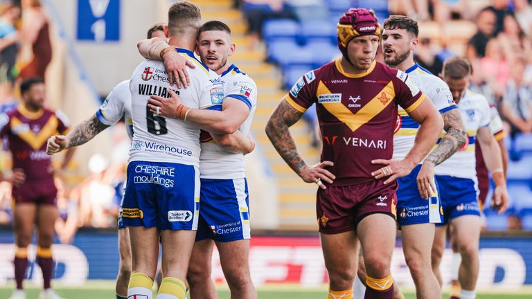 Huddersfield players celebrate a crucial second-half try 