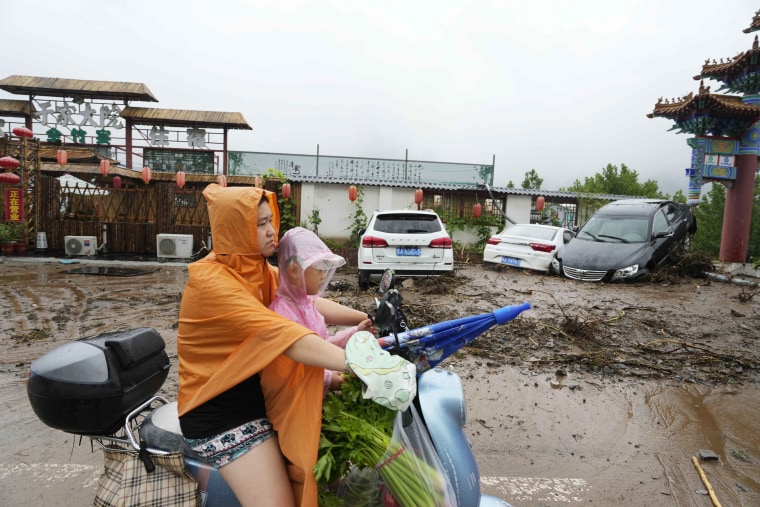 Chinese state media report some have died and others are missing amid flooding in the mountains surrounding the capital Beijing. 