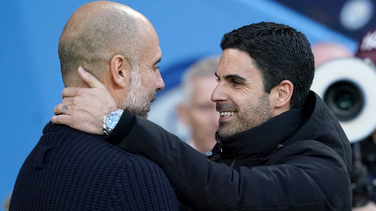 Manchester City manager Pep Guardiola (left) and Arsenal manager Mikel Arteta embrace before the Premier League match at the Etihad Stadium, Manchester. Picture date: Wednesday April 26, 2023.