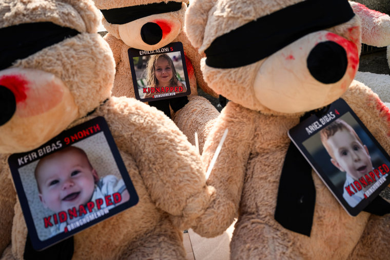 Posters for missing children and babies, believed to be held by Hamas, in Tel Aviv, Israel.