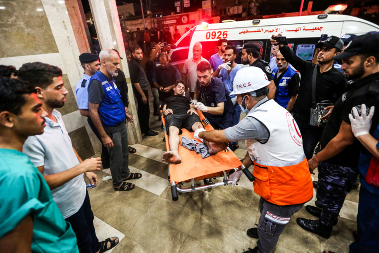 Injured people arrive at Nasser Medical Hospital in Khan Younis, Gaza.