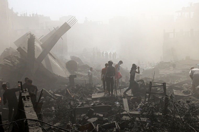 People search for the living and the dead in Khan Younis, Gaza.