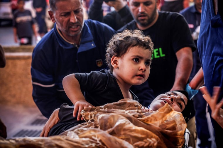 A wounded woman and her child are wheeled into the Nasser hospital in Khan Younis, Gaza.