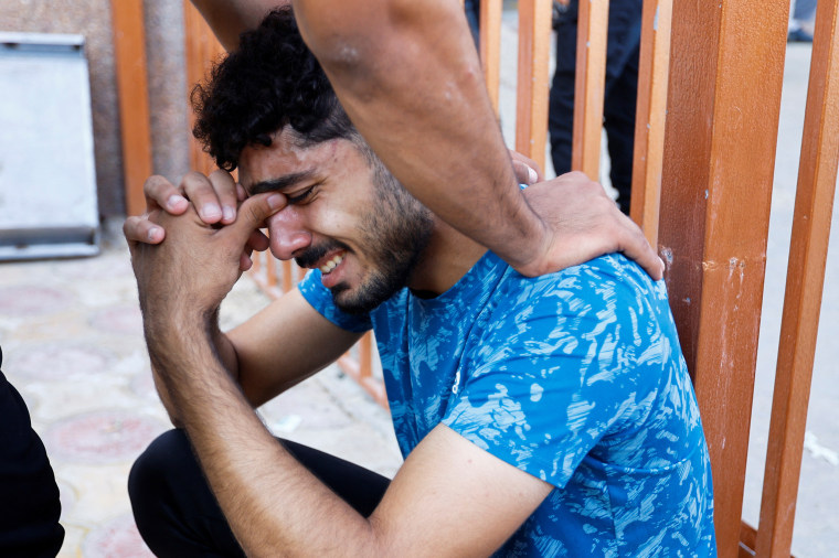 A mourner reacts during a funeral of Palestinians killed in Israeli strikes,, in Khan Younis