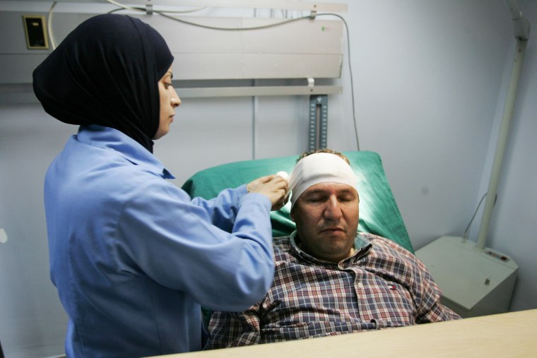 AFP photographer Hazem Bader receives treatment at al-Ahli hospital in Gaza on Oct. 31, 2008.