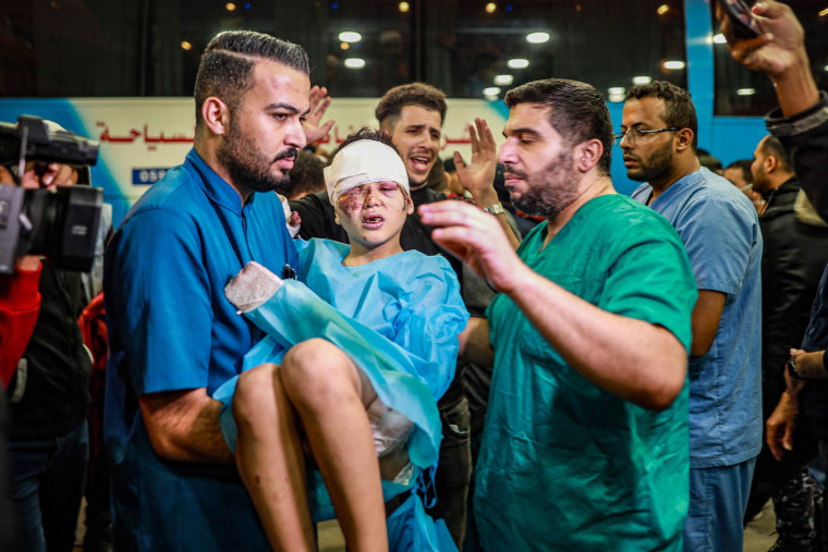 Injured Palestinians evacuated from the Indonesian hospital in the north of the Gaza Strip receive care at Nasser hospital in the Palestinian territory's southern city of Khan Yunis, on Nov. 20, 2023.