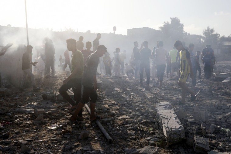 Palestinians inspect the damage of a destroyed mosque following an Israeli airstrike in Khan Younis refugee camp, southern Gaza Strip.