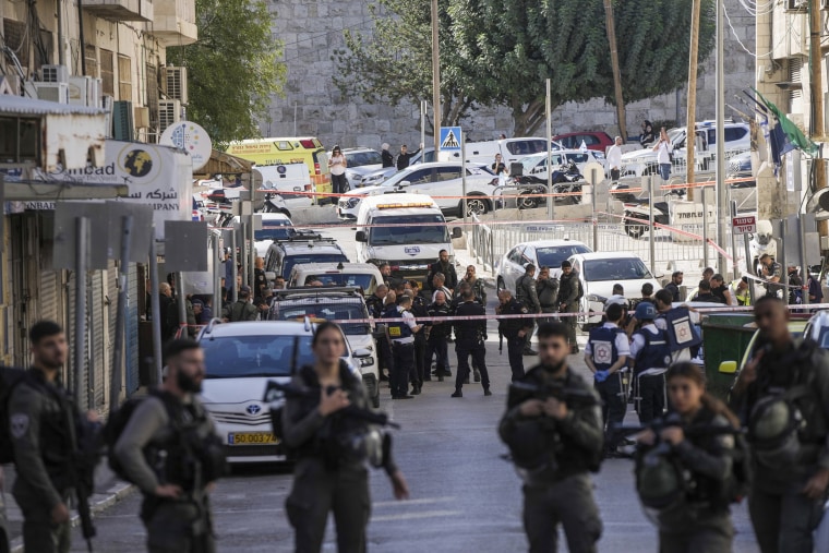 Two Israeli border police officers were stabbed near a police station in east Jerusalem, critically wounding one of them. 