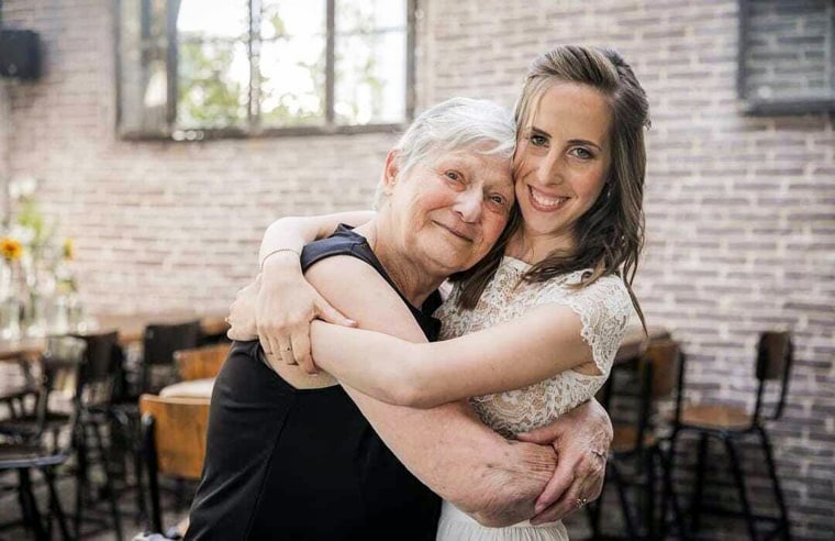 Yaffa Adar, left, hugs her granddaughter Adva Adar during her wedding in 2021.