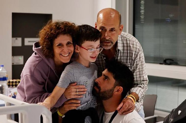 Keren Munder, left, and her son Ohad, center, at the Schneider Center for Pediatric Medicine in Peta Tikvah, Israel, after their release on Nov. 25. 