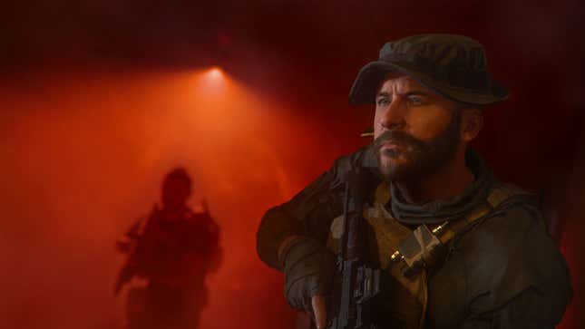 Captain Price stares off camera while another, blurry Task Force 141 member stands behind him bathed in a red light. 