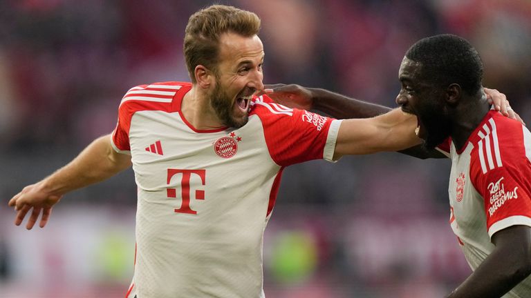 Bayern's Harry Kane, left, celebrates with his teammate Serge Gnabry