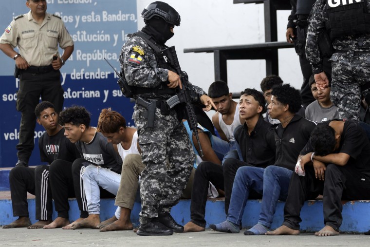 Police present to the press arrested men who the police identify as the attackers on the TC Television station, in Guayaquil, Ecuador