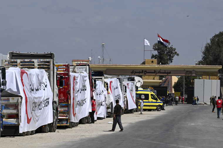 Hundreds of trucks full of aid sit idle near border with Gaza as crisis deepens