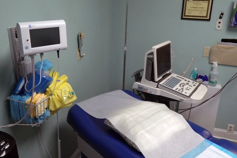 empty abortion clinic room examination table 