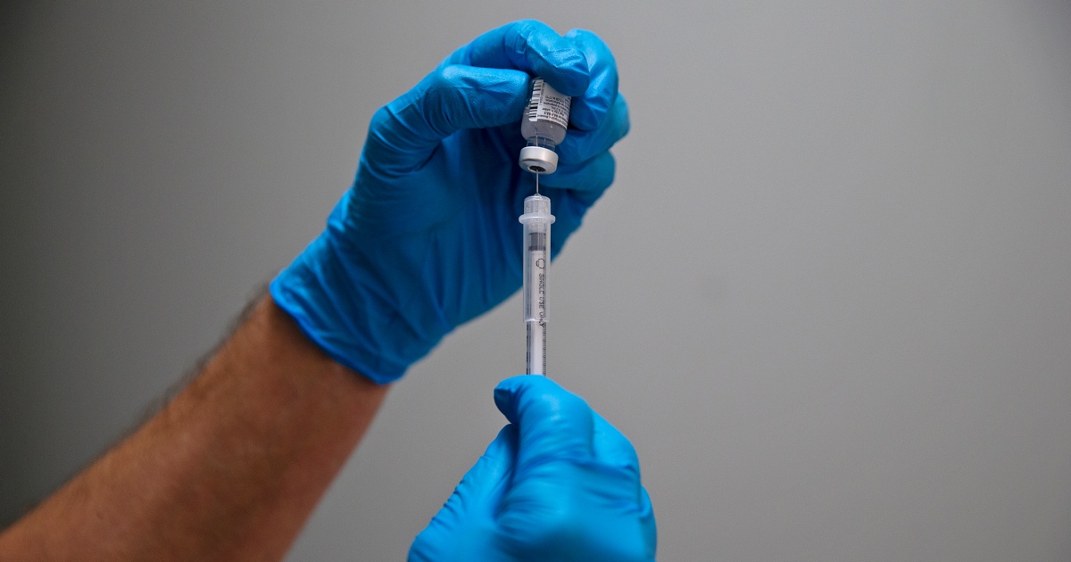 As Covid cases rise, CDC panel recommends new version of vaccine for fall