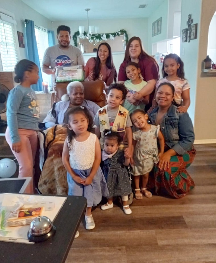 Pamela Jarrett, seated, with family. 