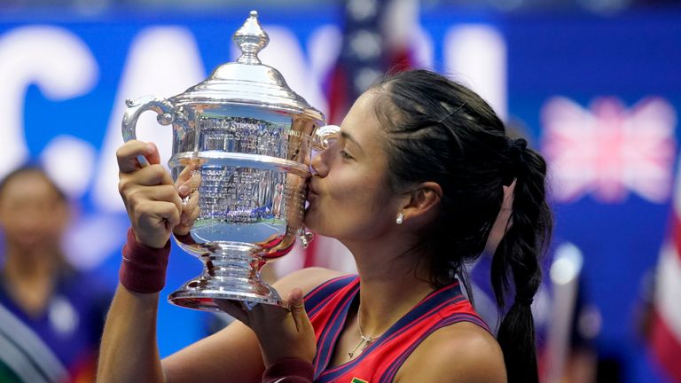 Emma Raducanu, of Britain, kisses the US Open championship trophy after defeating Leylah Fernandez, of Canada, during the women's singles final of the US Open tennis championships, Saturday, Sept. 11, 2021, in New York. (AP Photo/Seth Wenig) 