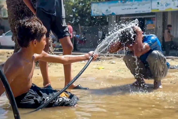 Two kids playing with water.