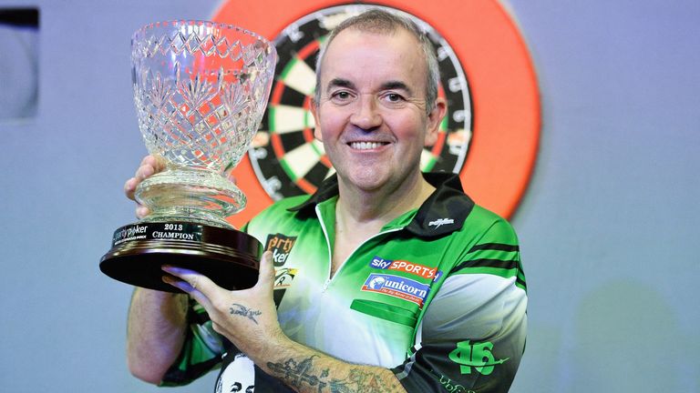 Phil Taylor holds up the trophy after winning the final against Dave Chisnall. Partypoker.com World Grand Prix Final, Citywest Hotel, Saggart, Co. Dublin. Picture credit: Barry Cregg / SPORTSFILE (Photo by Sportsfile/Corbis/Sportsfile via Getty Images)c