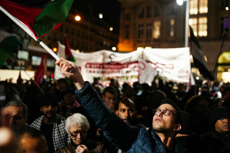 A man waves a Palestinian flag